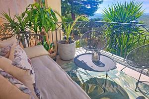 Salon extérieur sur terrasse couverte