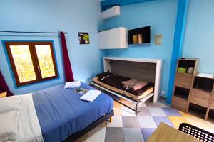 Chambre avec lit d'appoint