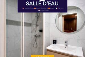 Salle d’eau fonctionnelle avec douche, lavabo et toilettes, équipée de serviettes et linge de bain, offrant confort et praticité au quotidien.